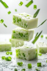 thai steamed layer cake flying with pandan scent, isolated on white background