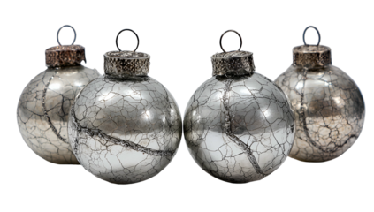 Four vintage silver Christmas ornaments with cracked finish, on black background