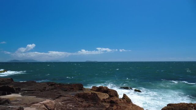 Turquoise Waves Crashing on Rocky Coastline &ndash; Garopaba, Brazil aerial drone shot