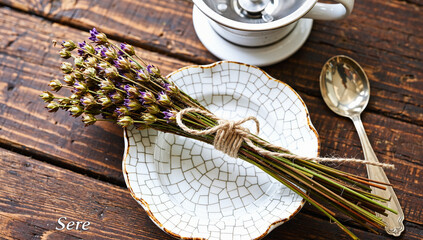 Dried Lavender Bundles on Crackled Ceramic Plate with Silverware