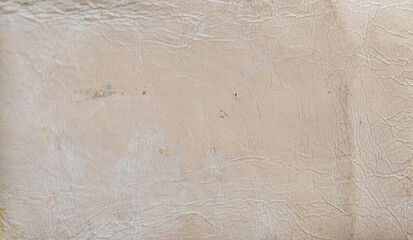 Old patent white leather texture. Surface has cracks and dirt, giving the product an aged