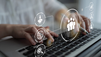 Business teamwork connected around a globe representing cooperation, leadership, and organizational...