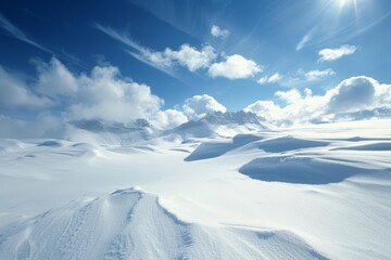Bright sun shining over snowy mountain peaks and a frozen landscape, creating a beautiful winter scene