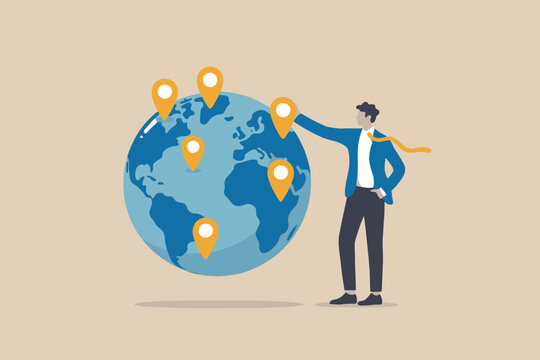 A businessman standing next to a globe with location pins, representing global business expansion