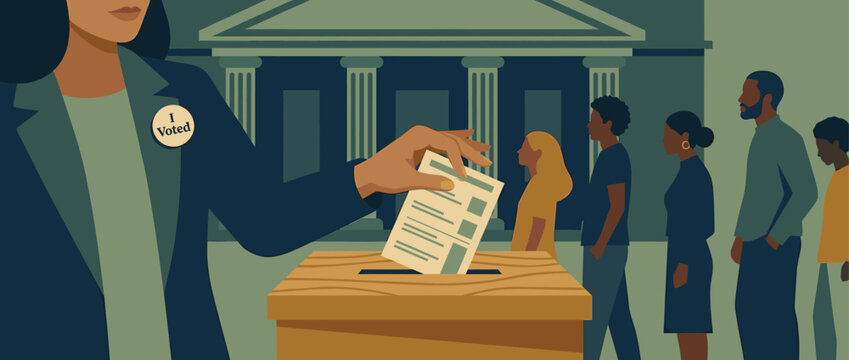 Woman wearing an 'I Voted' sticker casts her paper ballot into a wooden box at a polling station with a diverse line of citizens waiting