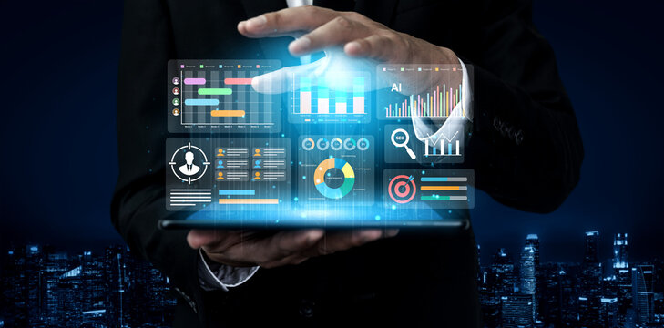 A modern business professional showcases a glowing digital display filled with vibrant charts and analytics, set against a night city skyline, emphasizing data-driven decision-making. Gantry - Powered by Adobe