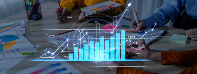 A team collaborates in a modern office, analyzing data and charts to drive strategic growth. Dynamic meeting environment showcases teamwork and innovation. Scalp
