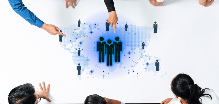 A diverse business team collaborates in a modern office, analyzing a digital network visualization to enhance strategy, communication, and focus on teamwork. Trope - Powered by Adobe