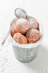 Delicious and sweet mini doughnuts as a tasty snack.