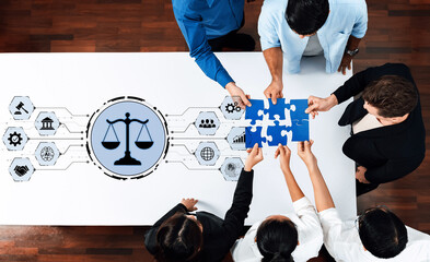 A diverse team works together to piece together a puzzle representing legal concepts, highlighting collaboration and innovation in modern business environments. Trope