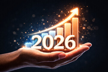 2026 rising growth concept with bar graph in hand
