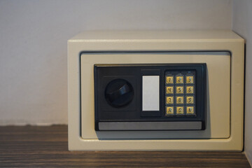 front view antique black and white steel Safe box on wooden floor and white wall background, object, furniture, money, electric, copy space