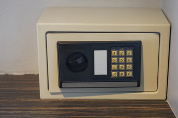 front view old black and white steel Safe box on wooden floor and white wall background, object, furniture, money, electric, copy space