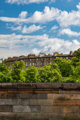 Edinburgh, Scotland, United Kingdom: roofs, palaces and the old town skyline, a glimpse of the ancient capital city seen from the Queensferry Road leading to Dean Village Dam
