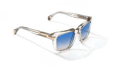 Sunglasses lying unfolded isolated on white background. Fashion Sunglasses for women with blue shade polarized lens.