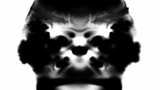 Inkblot test reveals abstract shapes and patterns. Psychological interpretation of symmetrical, dark ink on white.