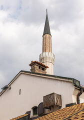 Minaret of Gazi Husrev Bega Mosque Above Historic Roofs, Sarajevo, Bosnia and Herzegovina.