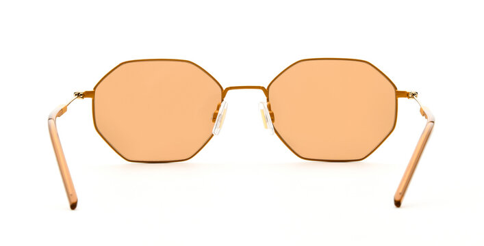 Sunglasses back view isolated on white background. Eyeglasses inside view Hexagonal frame with gold colored uv lens against sunlight. Glasses rear view modern style for design template