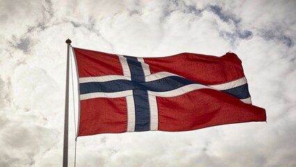 A striking Norwegian flag billows against a moody sky, perfect for travel-themed designs or patriotic projects.