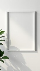 Off-white picture frame subtly angled on white wall , interior, rectangle, studio