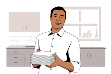 A man in a white shirt holds a stack of papers in a kitchen.