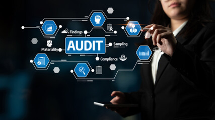 A focused businesswoman interacts with a digital interface, showcasing audit elements and compliance metrics, emphasizing the importance of analysis and strategy. Tessel