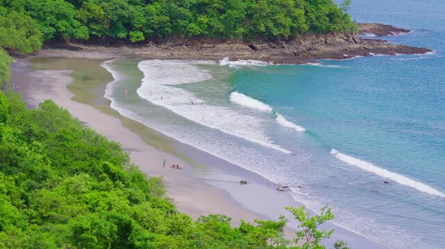 Aerial view of Playa Penca with turquoise water and green forest in Costa Rica