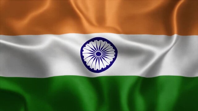 The national flag of India waving with saffron white and green horizontal stripes and the Ashoka Chakra wheel