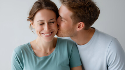 On white background pregnant woman enjoy maternity, hugs of loving husband display, young 35s couple feeling love, unborn baby anticipates parenthood, family motherhood pregnancy c