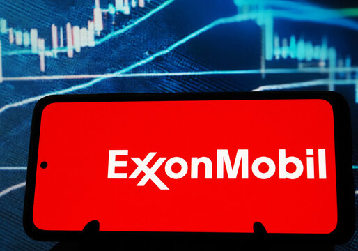 In this photo illustration, Exxon Mobil Corporation logo seen displayed on a monitor.
