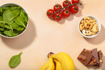 Magnesium rich foods healthy diet nutrition banana spinach nuts chocolate tomatoes copy space