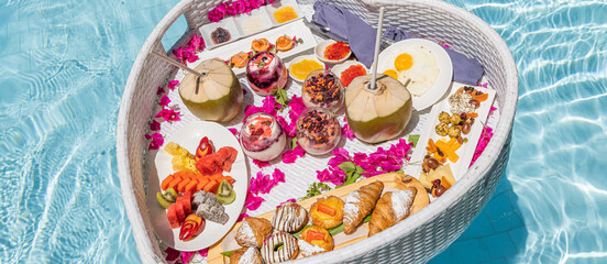 Luxury panoramic top view summer floating breakfast closeup tropical resort pool palm trees turquoise ocean view tranquil relaxation romantic love couple honeymoon anniversary morning scenic vacation