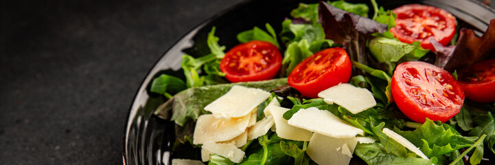 Parmesan cheese vegetable salad tomato, arugula, green leaf lettuce healthy food main course ingredient appetizer fresh tasty gourmet food background food top view copy space vegetarian food