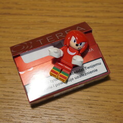 Fototapeta premium Red Lego Knuckles character toy on a pack of Terea tobacco sticks