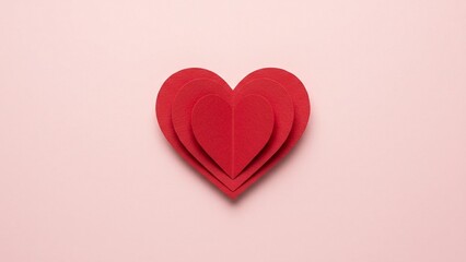 Layered Red Paper Heart on Soft Pink Background