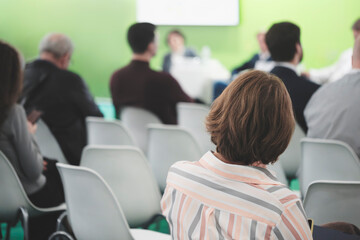 Business woman at business conference or presentation in conference room