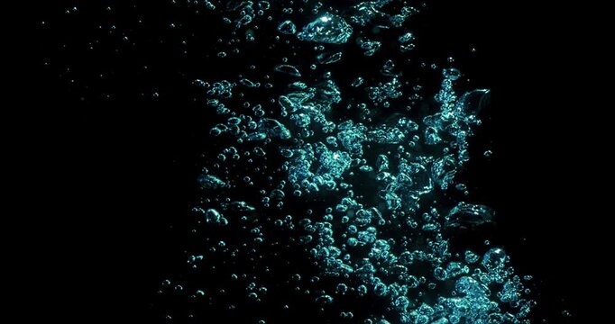 This highquality footage showcases vibrant air bubbles gracefully rising in clear water, making it perfect for motion graphics, captivating visual effects, and various abstract creative projects