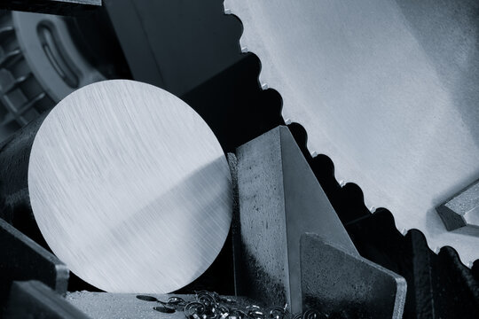 SAW automatic band saw machine cutting the metal bar with coolant method. The machine tool for industrial