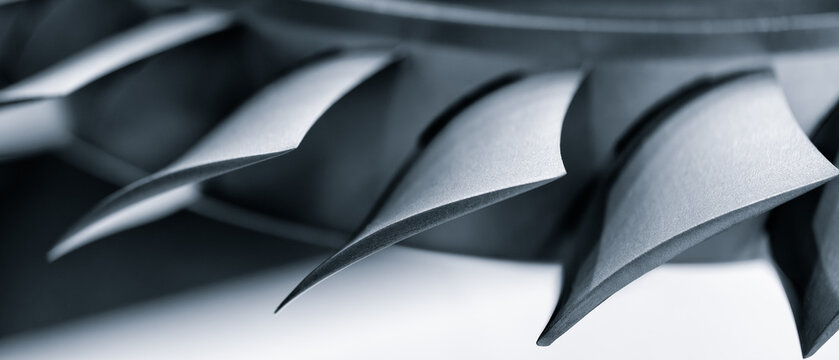 Steel blades of turbine propeller. Close-up view. Selected focus on foreground, industrial additive machinery technologies concept