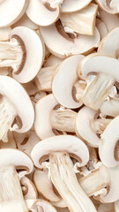 Fresh white champignon mushroom slices background texture pattern