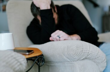 Fototapeta premium Middle Aged Man Gets Mobile Phone Notification of Suspicious Foreign Banking Transactions - FinTech Cybersecurity Mobile Banking Alerts Concept