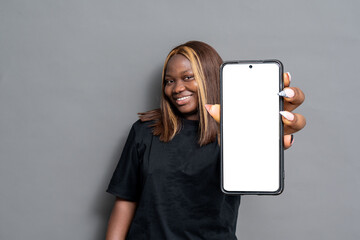 young black lady showing her phone screen with copy space
