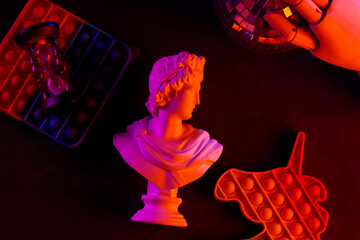 Classical Greek Bust Sculpture with Colorful Fidget Pop It Toys Purple Orange Neon Lighting