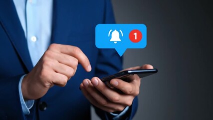 A businessman points at a smartphone displaying a new notification bell icon with a red count.