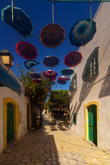 A narrow street in the old town of Mahdia in northeastern Tunisia on the Mediterranean Sea, a travel background or wallpaper for your project