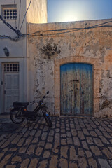 A narrow street in the old town of Mahdia in northeastern Tunisia on the Mediterranean Sea, a travel background or wallpaper for your project