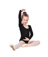 Young girl sitting in ballet pose