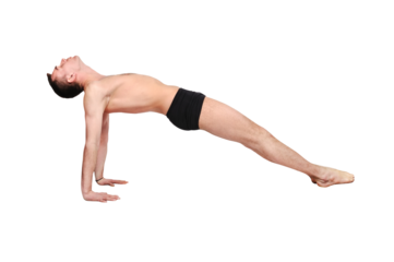 A muscular man doing a yoga asana