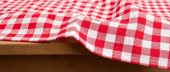 Red and white checkered tablecloth on a wooden table
