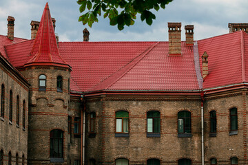 dramatic castle north Europe landmark aesthetic fortress building facade under moody cloudy sky in rainy time